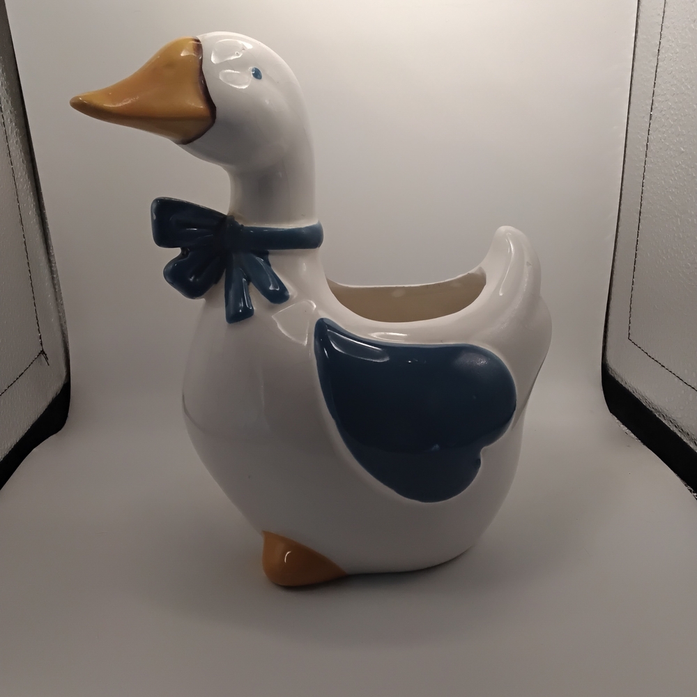 mark. White Ceramic Goose Planter with Blue and Yellow Accents